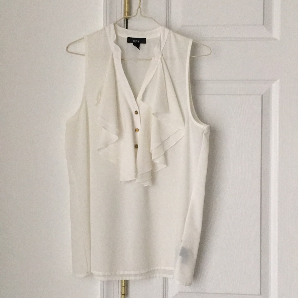 White sleeveless ruffle blouse